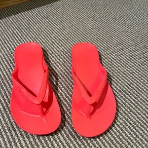 Archie’s Vibrant Red Flip Flops